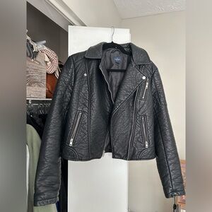 Black faux leather jacket with silver zippers